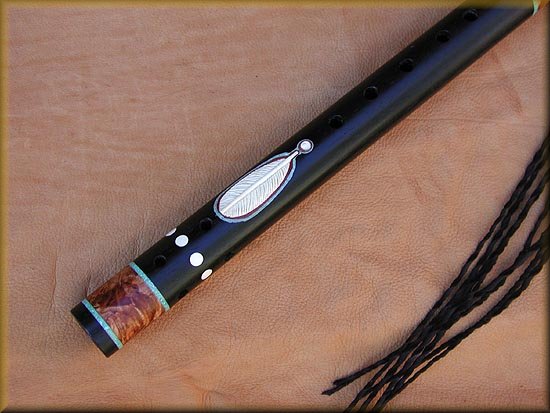 Eight inlay ivory dots are placed around the bottom of the ebony Flute.